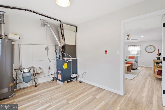 utility room with water heater and heating unit