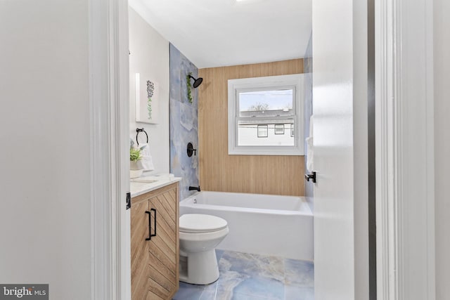 full bath with bathtub / shower combination, vanity, and toilet