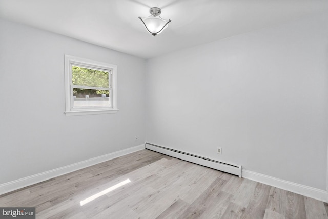 1302 Ashbridge Rd, West Chester, PA 19380 - spare room with a baseboard heating unit, wood finished floors, and baseboards