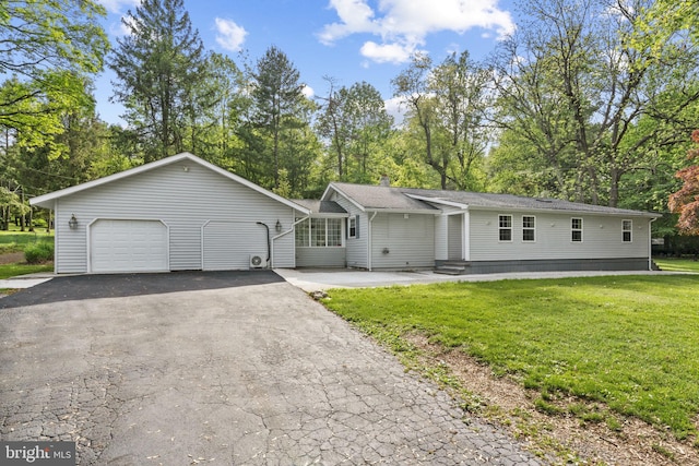 1302 Ashbridge Rd, West Chester, PA 19380 - view of front facade featuring a front yard, a garage, driveway, and view of scattered trees