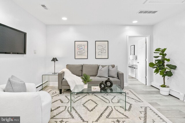 1302 Ashbridge Rd, West Chester, PA 19380 - living room with baseboard heating, wood finished floors, recessed lighting, and baseboards