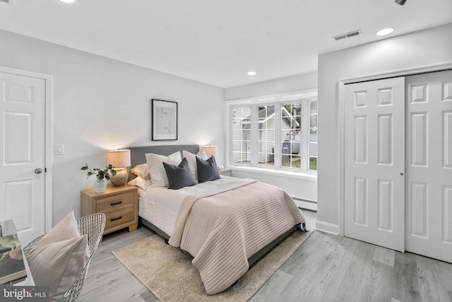 1302 Ashbridge Rd, West Chester, PA 19380 - bedroom featuring a baseboard radiator, light wood finished floors, a closet, and recessed lighting