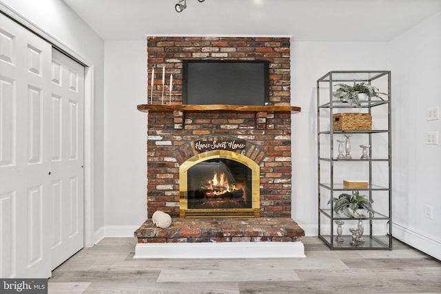 1302 Ashbridge Rd, West Chester, PA 19380 - unfurnished living room with wood finished floors, a fireplace, and baseboards