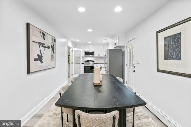 1302 Ashbridge Rd, West Chester, PA 19380 - dining space featuring recessed lighting, light wood-style flooring, a baseboard heating unit, and baseboards