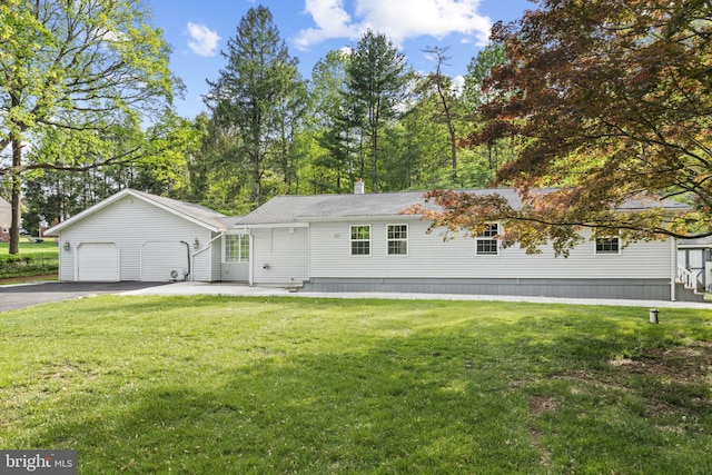 1302 Ashbridge Rd, West Chester, PA 19380 - view of front facade featuring a garage, driveway, and a front yard
