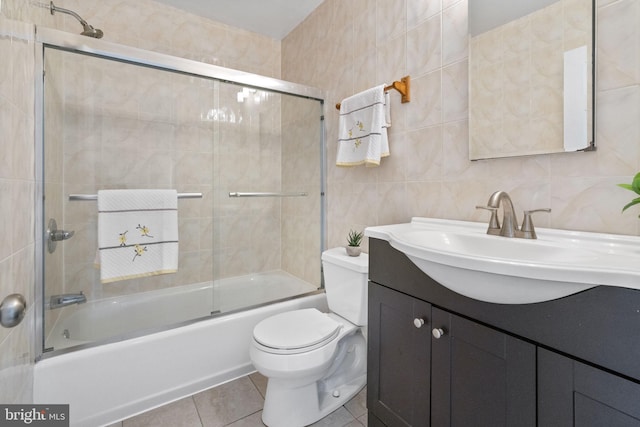 1302 Ashbridge Rd, West Chester, PA 19380 - bathroom with tile walls, toilet, combined bath / shower with glass door, vanity, and tile patterned flooring