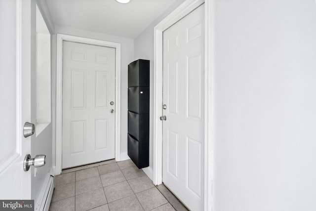 1302 Ashbridge Rd, West Chester, PA 19380 - doorway to outside featuring light tile patterned floors, baseboard heating, and baseboards