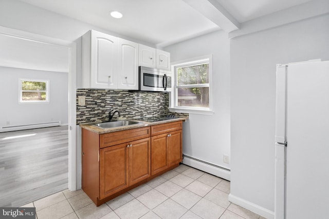 1302 Ashbridge Rd, West Chester, PA 19380 - kitchen with baseboard heating, a sink, freestanding refrigerator, and stainless steel microwave