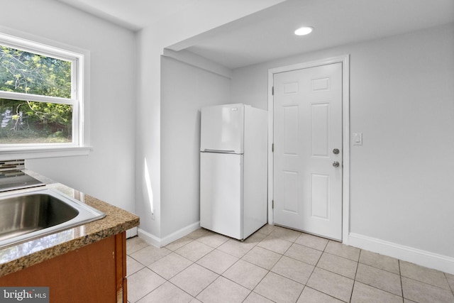 1302 Ashbridge Rd, West Chester, PA 19380 - kitchen with freestanding refrigerator, baseboards, light tile patterned floors, a sink, and recessed lighting