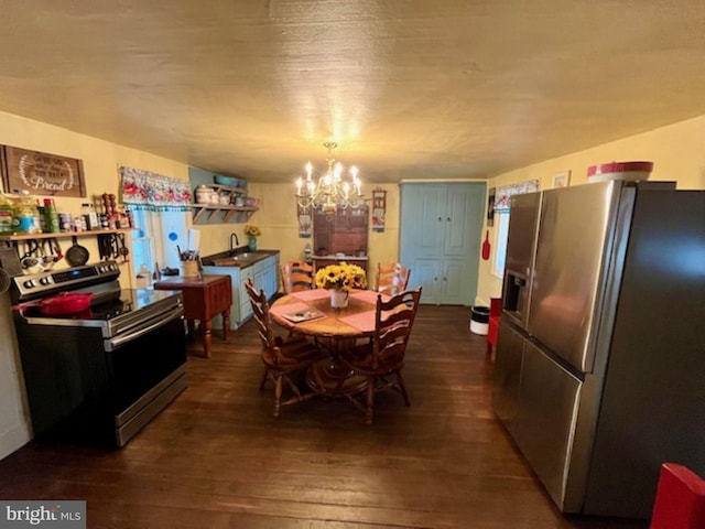 dining area with a chandelier and dark wood-style floors