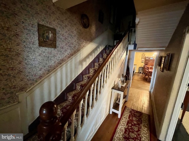 stairway featuring wood finished floors