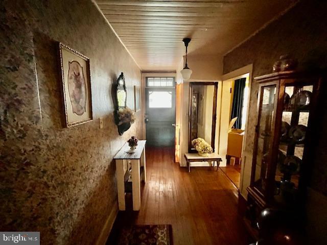 hall featuring dark wood-style floors
