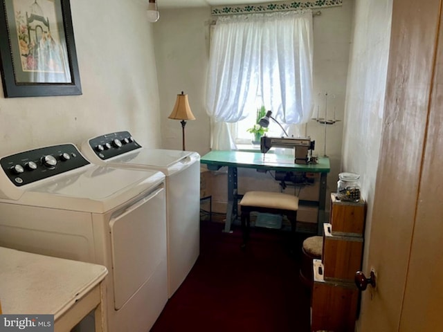 washroom with washing machine and dryer, laundry area, and a healthy amount of sunlight