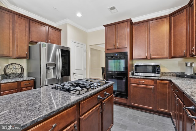 7027 Sand Cherry Way, Clinton, MD 20735 - kitchen featuring black appliances, dark stone counters, crown molding, and recessed lighting