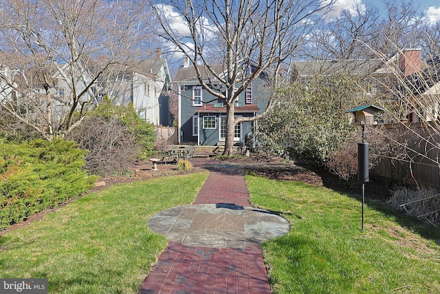 view of front of property with fence and a front yard