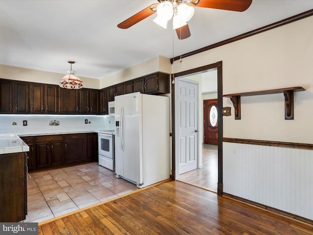 4216 Valley Vista Ct, Manchester, MD 21102 - kitchen with tile counters, white appliances, ceiling fan, and dark brown cabinets