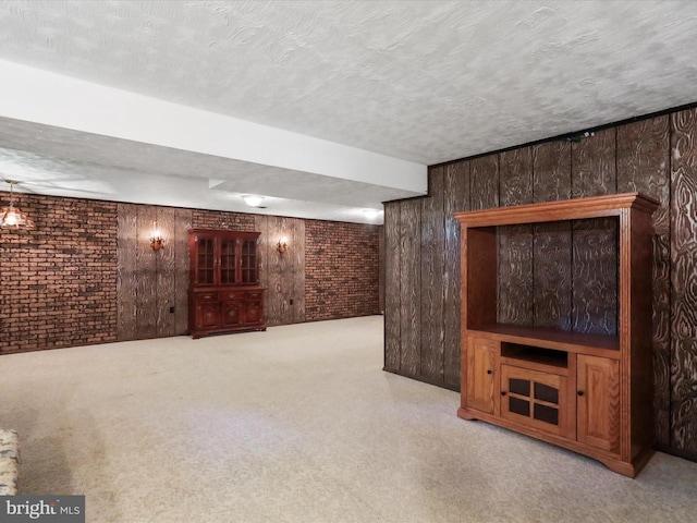 4216 Valley Vista Ct, Manchester, MD 21102 - finished below grade area with a textured ceiling, wood walls, and brick wall
