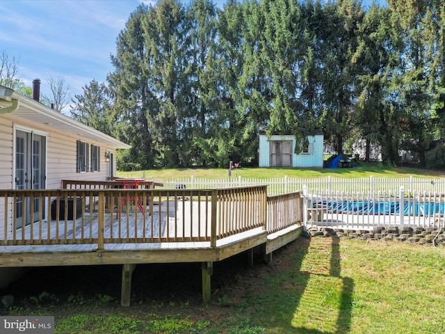 4216 Valley Vista Ct, Manchester, MD 21102 - wooden terrace featuring a storage shed, a yard, a fenced in pool, and an outdoor structure