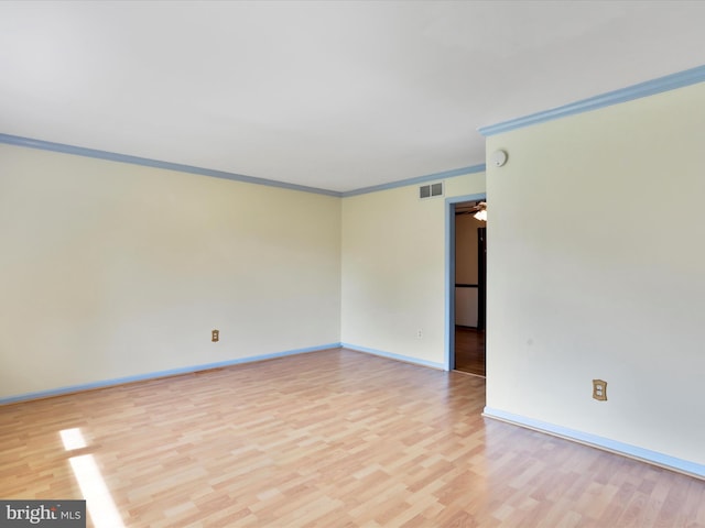 4216 Valley Vista Ct, Manchester, MD 21102 - spare room featuring crown molding, baseboards, light wood-type flooring, and visible vents