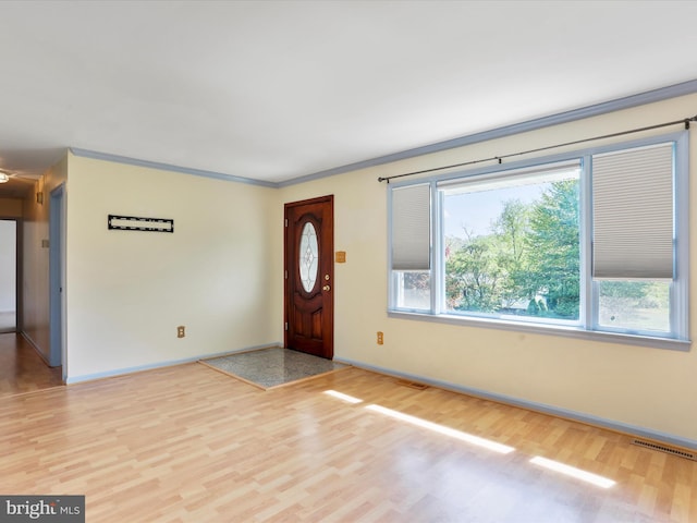 4216 Valley Vista Ct, Manchester, MD 21102 - foyer with baseboards, light wood-style flooring, crown molding, and visible vents