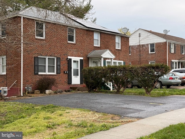 3750 Derry St, Harrisburg, PA 17111 - view of front of home featuring brick siding, solar panels, and entry steps
