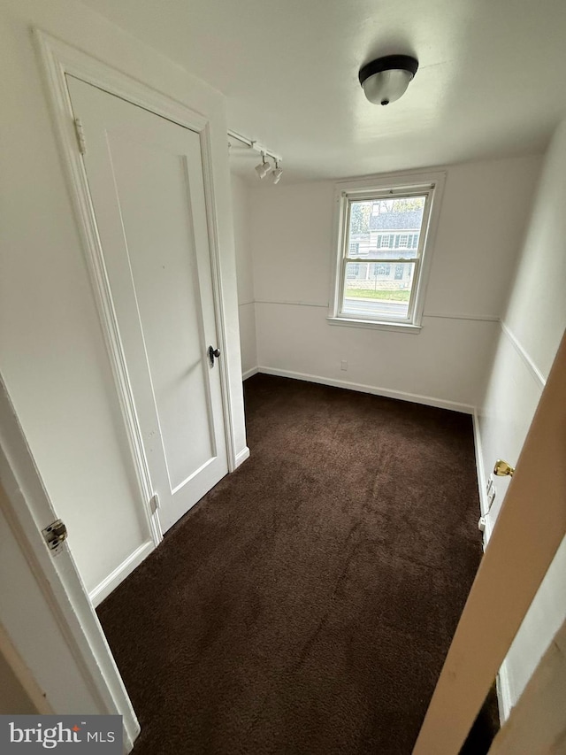 3750 Derry St, Harrisburg, PA 17111 - unfurnished bedroom with dark carpet and baseboards