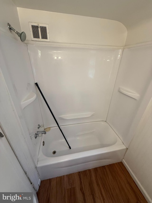3750 Derry St, Harrisburg, PA 17111 - bathroom with  shower combination, visible vents, and wood finished floors