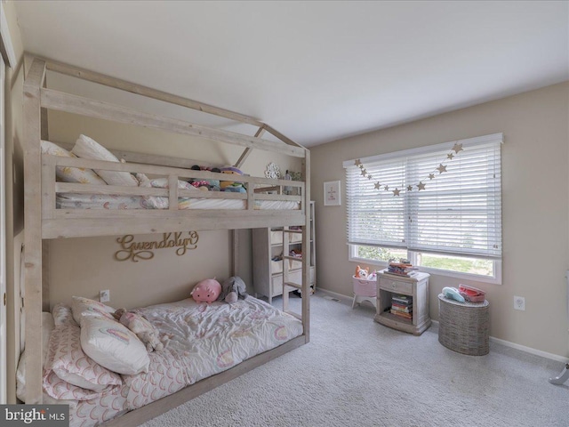 bedroom with carpet floors and baseboards