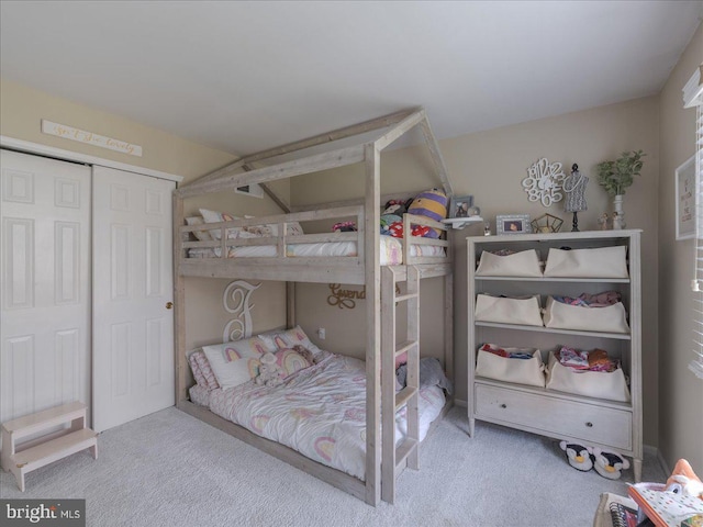 carpeted bedroom featuring a closet