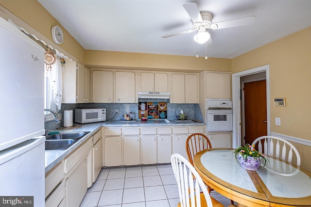 1713 Marla Pl, Vineland, NJ 08361 - kitchen featuring light tile patterned floors, a sink, light countertops, white appliances, and under cabinet range hood