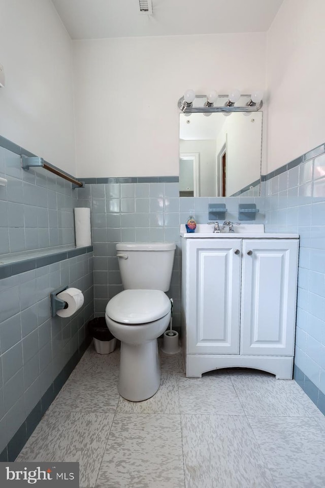 1713 Marla Pl, Vineland, NJ 08361 - half bathroom with toilet, tile patterned flooring, a wainscoted wall, and tile walls
