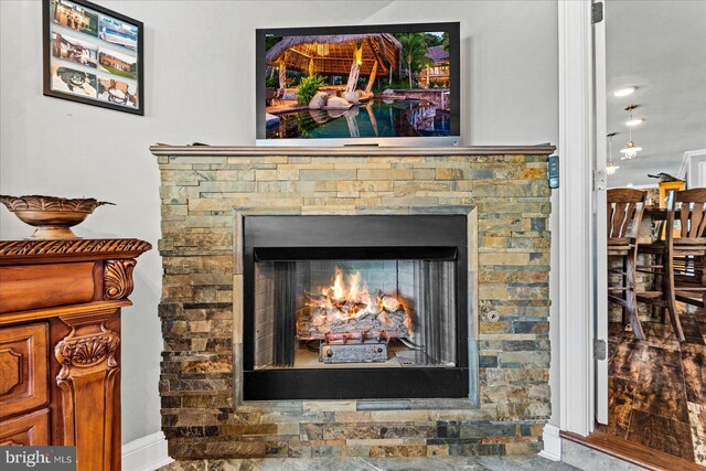 interior details featuring a fireplace and baseboards