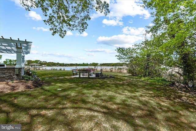 view of yard featuring a boat dock and a water view