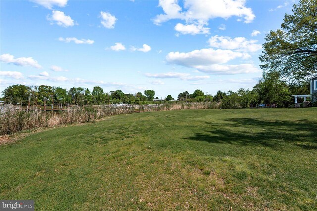 view of yard with a rural view