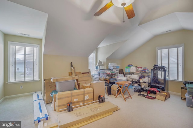 bonus room with carpet flooring, visible vents, vaulted ceiling, and ceiling fan