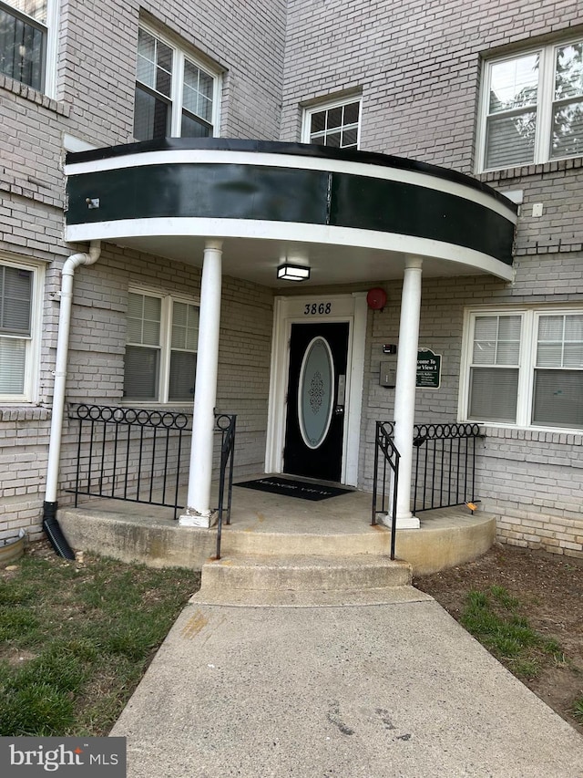 3868 9th St SE Unit 101, Washington, DC 20032 - entrance to property featuring brick siding and a porch