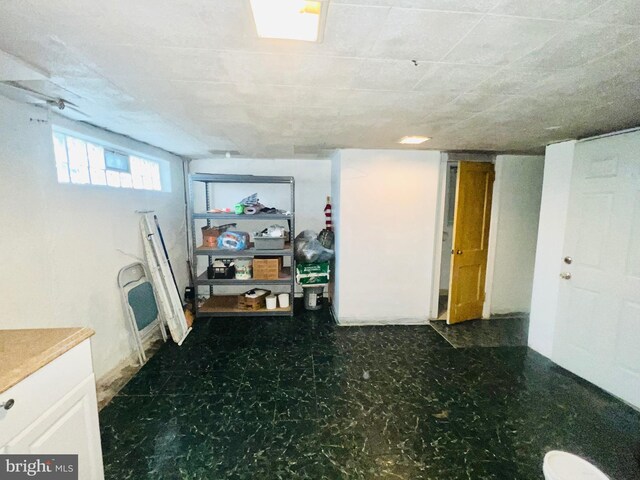 basement featuring tile patterned floors
