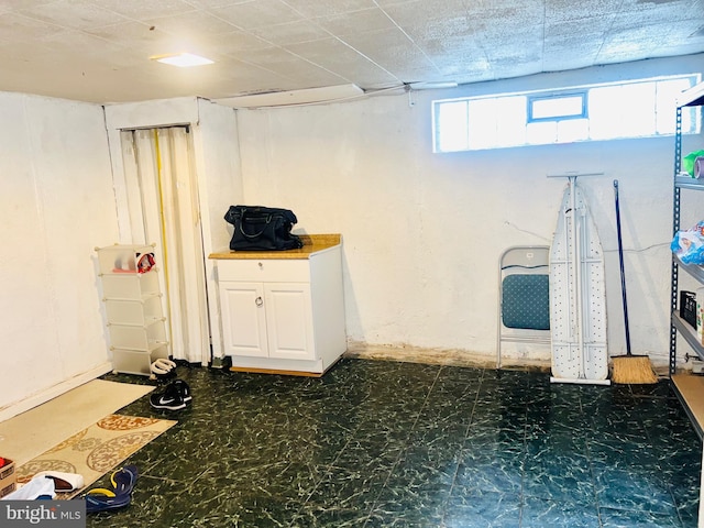 basement featuring tile patterned floors