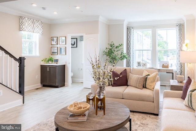 living room with baseboards, ornamental molding, recessed lighting, stairway, and light wood-style flooring