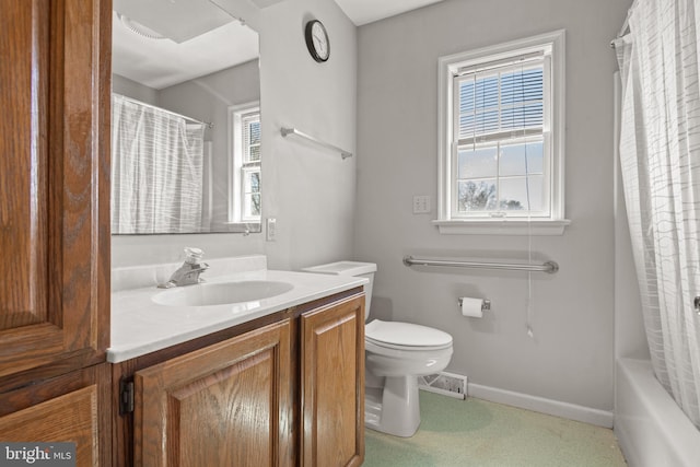 bathroom with vanity, toilet, visible vents, and baseboards