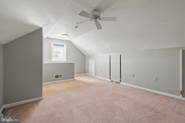 bonus room featuring ceiling fan, baseboards, visible vents, and carpet floors