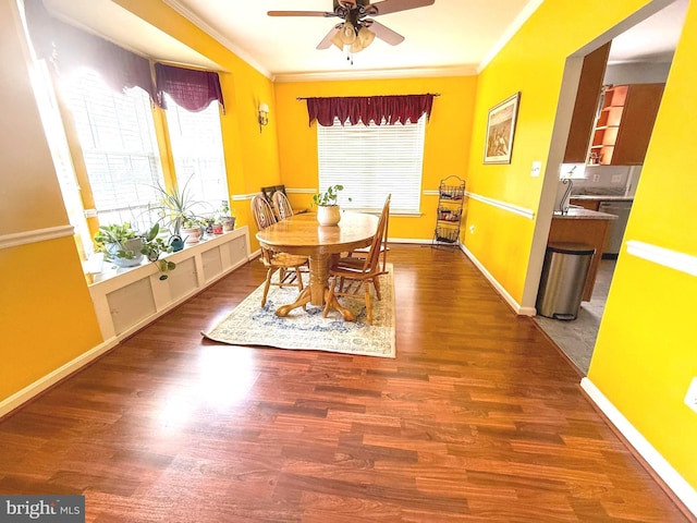 10861 Smugglers Notch Ct, White Plains, MD 20695 - dining space featuring crown molding, a ceiling fan, wood finished floors, and baseboards