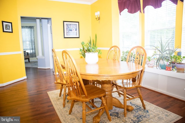 10861 Smugglers Notch Ct, White Plains, MD 20695 - dining area featuring dark wood-type flooring, crown molding, and baseboards