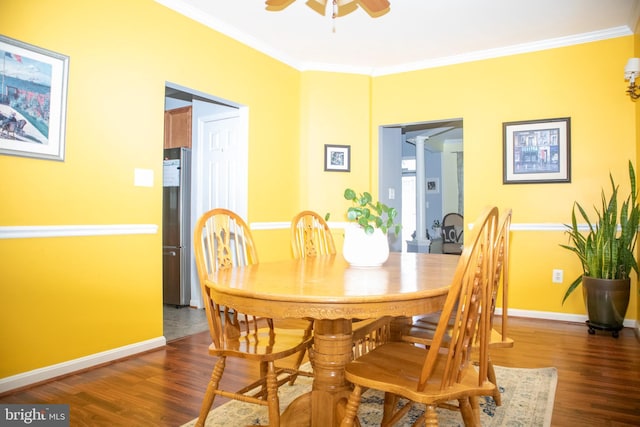 10861 Smugglers Notch Ct, White Plains, MD 20695 - dining space with dark wood finished floors, ornamental molding, a ceiling fan, baseboards, and ornate columns