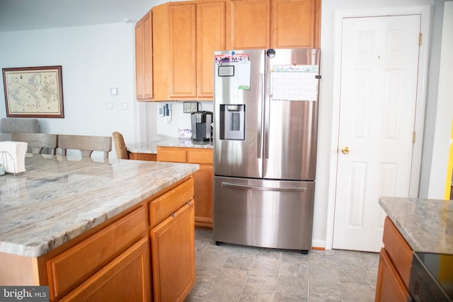 10861 Smugglers Notch Ct, White Plains, MD 20695 - kitchen with stainless steel refrigerator with ice dispenser and light stone countertops