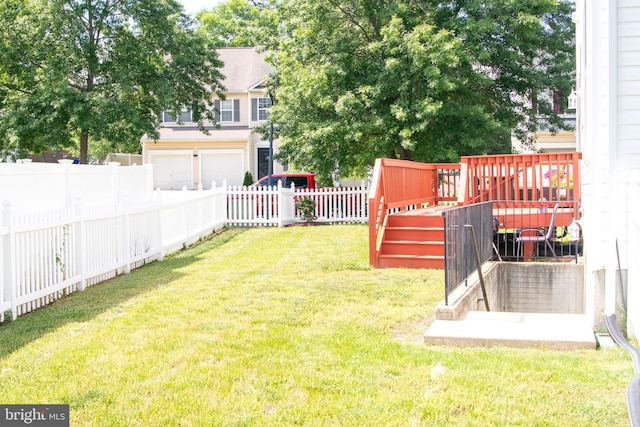 10861 Smugglers Notch Ct, White Plains, MD 20695 - view of yard featuring a wooden deck and an attached garage
