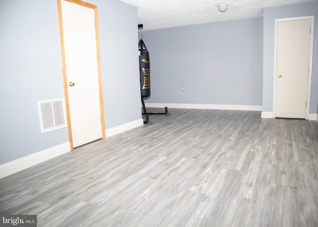 10861 Smugglers Notch Ct, White Plains, MD 20695 - below grade area featuring wood finished floors and baseboards