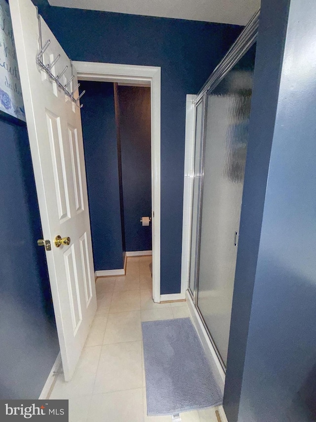 10861 Smugglers Notch Ct, White Plains, MD 20695 - full bath featuring a shower stall, tile patterned floors, and baseboards