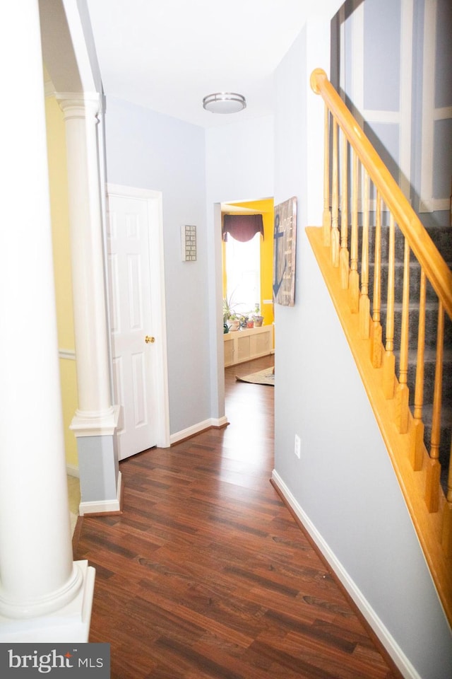 10861 Smugglers Notch Ct, White Plains, MD 20695 - hall with ornate columns, wood finished floors, stairs, and baseboards