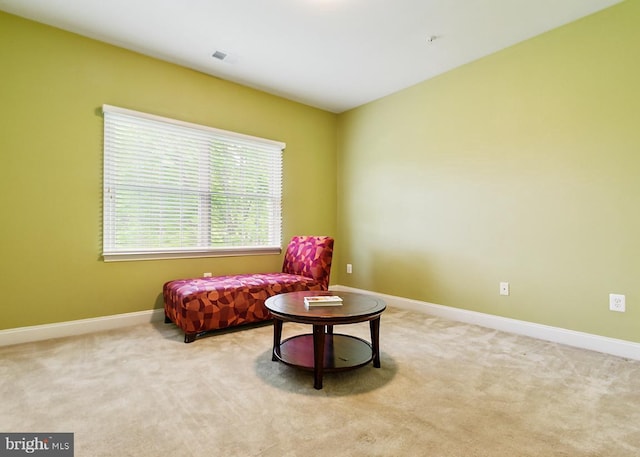 sitting room with carpet flooring and baseboards